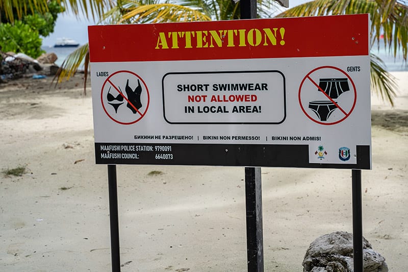 Not wearing bikinis or short swimwears sign on local beaches in the Maldives