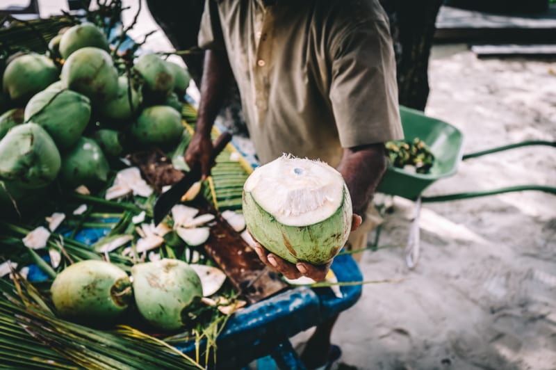 Fresh coconut water at a Maldivian beach