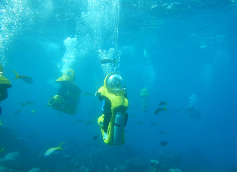 Having fun riding an underwater scooter in the Maldives