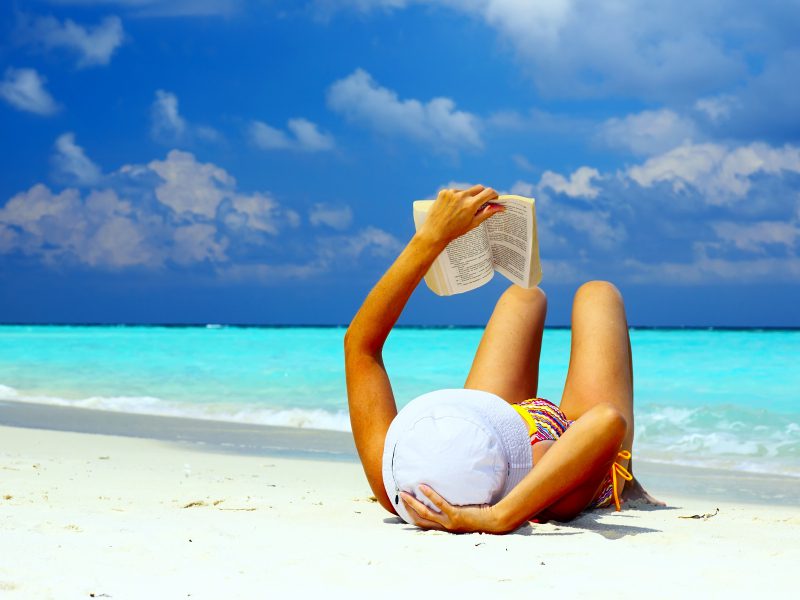 Reading on a beach in the Maldives