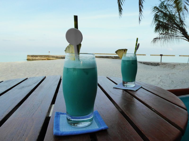 Enjoying a drink at a beachside Rasdhoo restaurant