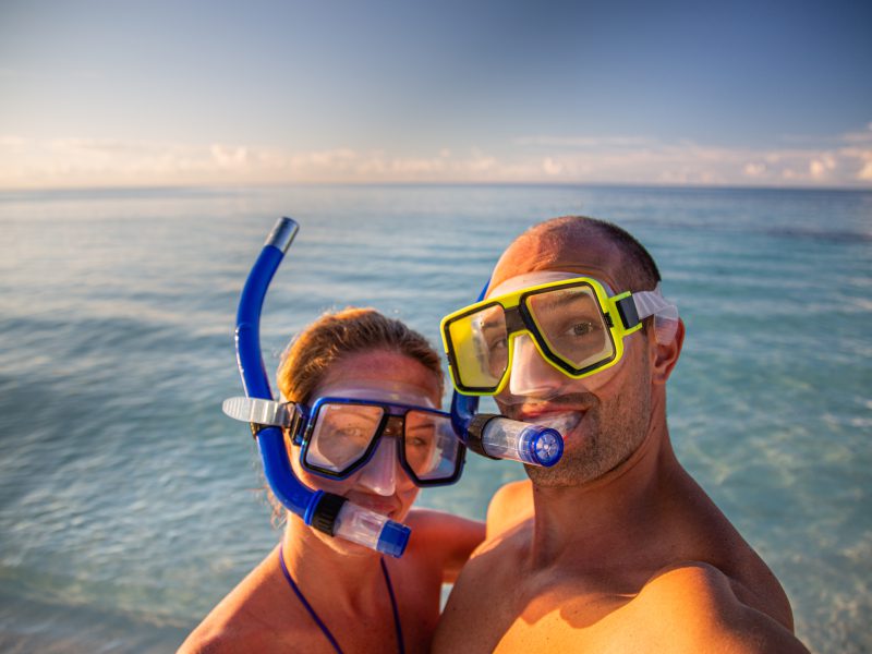 Couple enjoying snorkeling in Maldives