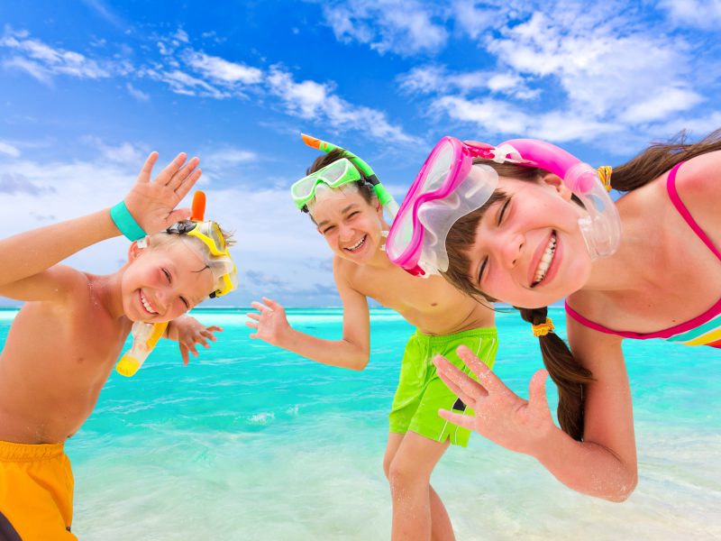 Children playing of beach in Maldives