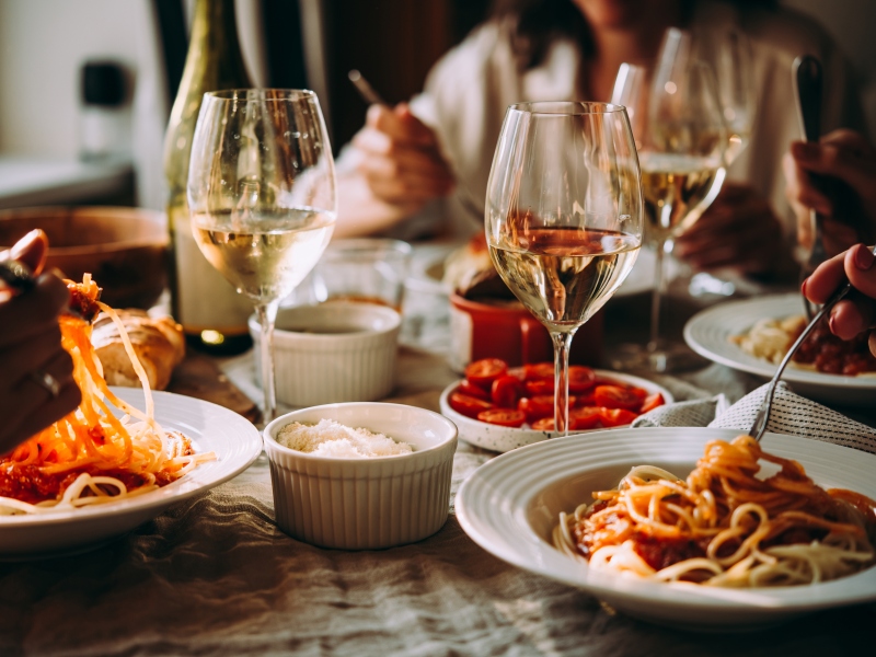 Guests enjoying Italian pasta