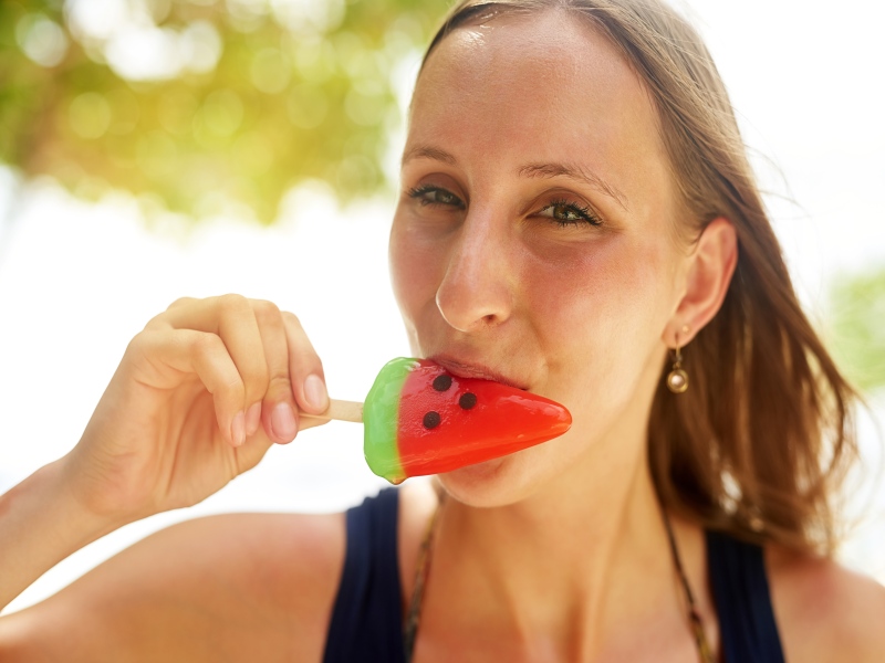 Watermelon popsicle on the beach 